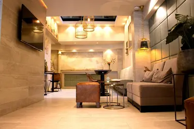 a living room with a couch and a table at Hotel The Bird in Amsterdam