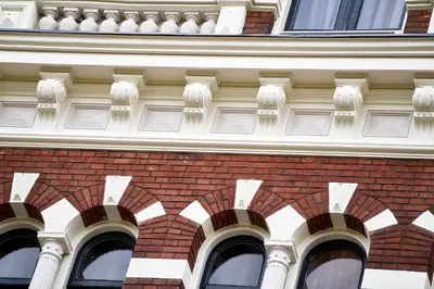 a building with arches on the side of it at Hotel The Bird in Amsterdam
