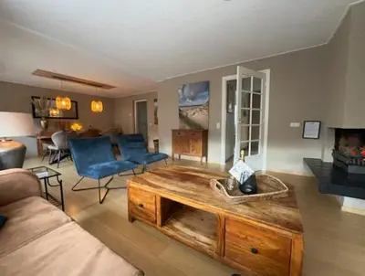 a living room with a couch and a coffee table at Apartments Four Seasons Voorstraat in Egmond aan Zee