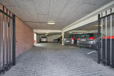 a parking garage with cars parked in it at Apartments Four Seasons Zuiderstraat in Egmond aan Zee