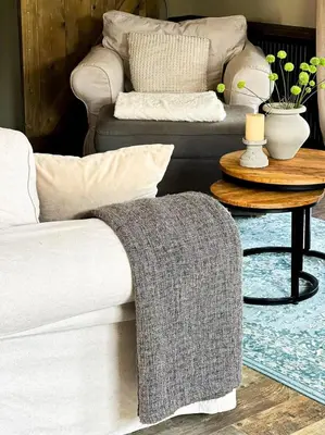 a living room with two couches and a table at De Koolschuur in Heerhugowaard
