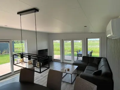 a living room with a couch and a table at Miva in Leiderdorp