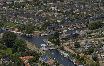 an aerial view of a city with a river at Spes Salutis in Badhoevedorp