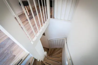 an overhead view of a staircase with wooden floors at Plantage Garden Apartments in Amsterdam
