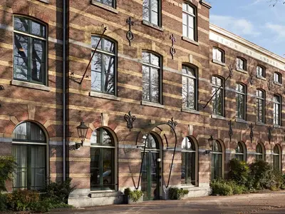 a large brick building with many windows on it at YAYS Amsterdam Maritime by Numa in Amsterdam