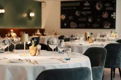 a group of tables with wine glasses on them at Leerhotel Het Klooster in Amersfoort