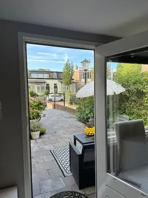 a view of a patio from a sliding glass door at Garden house, Free parking in Zandvoort