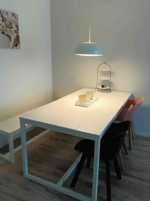 a blue table with a light on top of it at Schitterend appartement, 150 m van het strand in Katwijk aan Zee