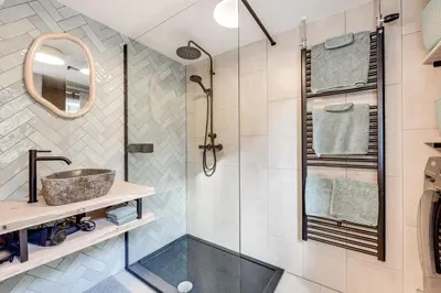 a bathroom with a shower and a sink at Dorpsgeluk centrum Uitgeest in Uitgeest