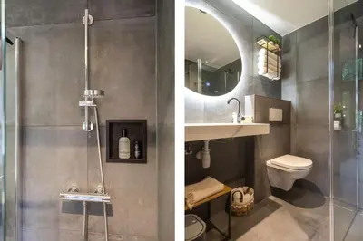 a bathroom with a shower and a sink and a toilet at The Green Pine Tree in Zandvoort
