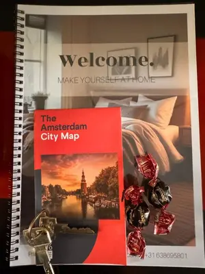a book with a picture of a city map and keys at Décor Canal House in Amsterdam
