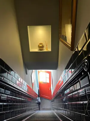 a view of a large empty room with a red door at Décor Canal House in Amsterdam