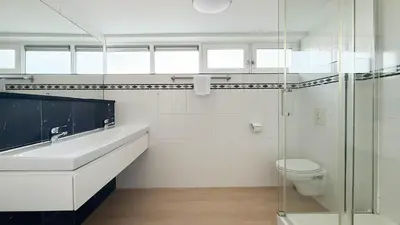 a bathroom with a toilet and a sink and a shower at Jachtzicht by Droomvilla in Uitgeest