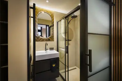 a bathroom with a sink and a mirror at Villa B&B Bovenkarspel in Bovenkarspel