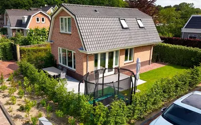 an aerial view of a house with a basketball hoop at Vakantiepark Duinrust in Noordwijk