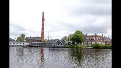 a large body of water with buildings and a factory at Nice Spacious House Near Amsterdam And Schiphol in Zwanenburg