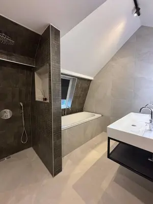 a bathroom with a sink and a bath tub at Luxury 6pers appartement Abcoude in Abcoude