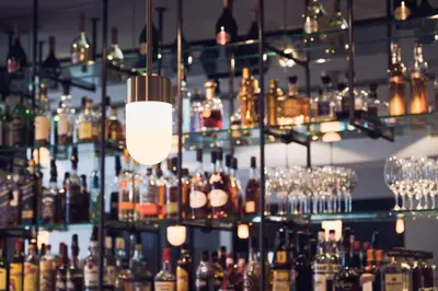 a bar with a lot of bottles and glasses at Morgan & Mees Amsterdam in Amsterdam