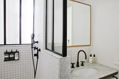 a bathroom with a sink and a mirror at Morgan & Mees Amsterdam in Amsterdam