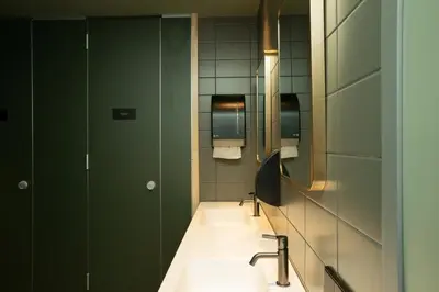 a bathroom with a sink and a mirror at The Elephant Hostel in Amsterdam