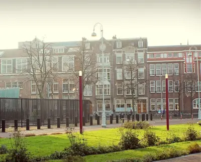 a large brick building with a street light in front of it at M-Square in Amsterdam
