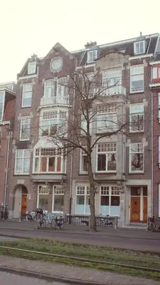 a large brick building with a tree in front of it at M-Square in Amsterdam