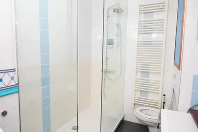 a bathroom with a shower and a toilet at redlight canalview city centre in Amsterdam
