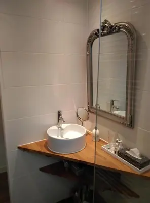 a bathroom with a sink and a mirror at B&B Hoofddorp in Hoofddorp