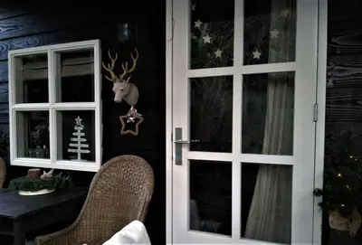 a door with a deer head on the wall at B&B Hoofddorp in Hoofddorp