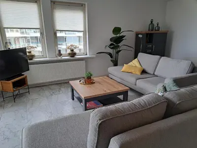 a living room with two couches and a coffee table at Atlantis 16b in Egmond aan Zee