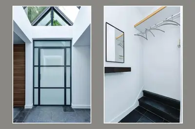 a house with a glass door and a stair case at Luxury semi-detached house near Amsterdam in Loenen aan de Vecht
