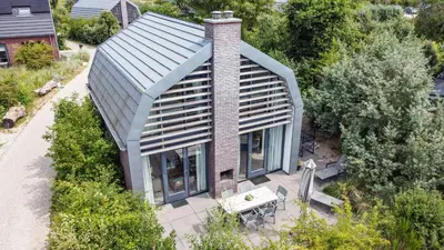 an overhead view of a house with a roof at Villa Duinroos in Egmond aan den Hoef