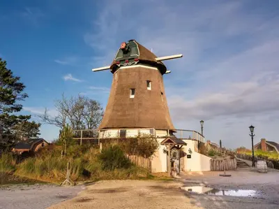a windmill on top of a hill at Villa Zeester in Egmond aan den Hoef