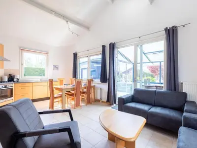 a living room with a couch and a table at Bungalow in Wervershoof with 1 bedroom in Wervershoof