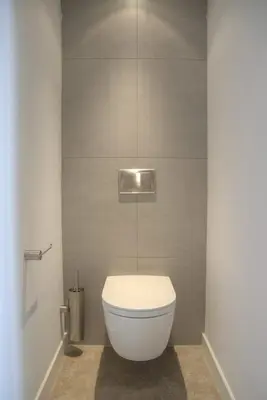a bathroom with a white toilet in a room at Atlantis 14 in Egmond aan Zee