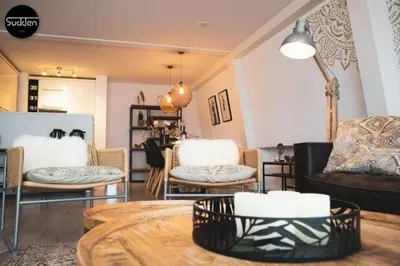a living room with chairs and a table at Atlantis 18 in Egmond aan Zee