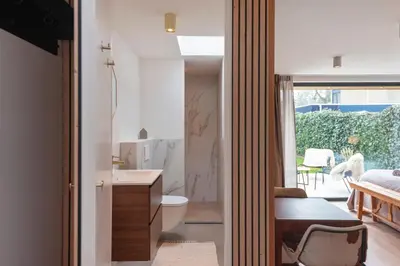 a bathroom with a sink and a toilet in a room at Studio Campo in Bentveld