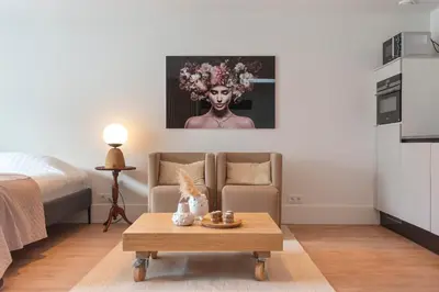 a living room with a couch and a table at Studio Campo in Bentveld