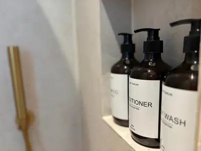 a group of three bottles sitting on a shelf at Studio No3 in Katwijk aan Zee