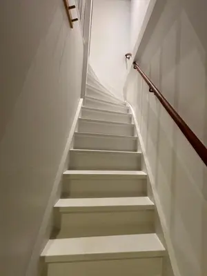 a staircase in a building with white steps at Studio No3 in Katwijk aan Zee