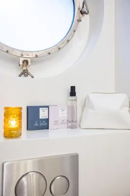 a bathroom with a mirror and a sink and a sink at Boat suite - A Unique Houseboat Stay in Amsterdam in Amsterdam