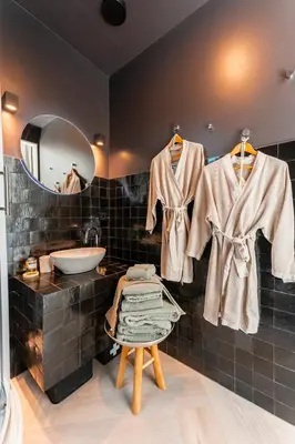 a bathroom with a sink and a mirror at The Gentle Arch Schiphol Amsterdam in Aalsmeer