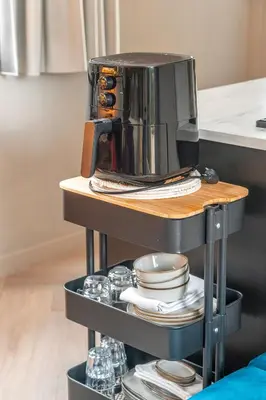 a coffee maker on a shelf in a kitchen at The Gentle Arch Schiphol Amsterdam in Aalsmeer