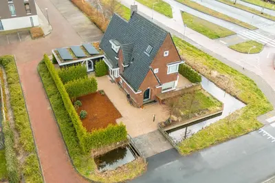 an aerial view of a house with a yard at The Gentle Arch Schiphol Amsterdam in Aalsmeer