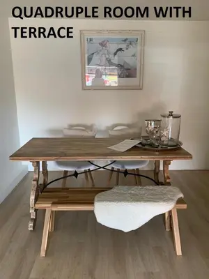 a table in a room with a table with at El Sol Zandvoort 2 in Zandvoort