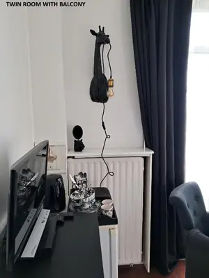 a room with a desk with a computer and a monitor at El Sol Zandvoort 2 in Zandvoort