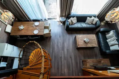 a living room with a couch and a table at Spacious Nature Escape, house for 6 near Amsterdam & Sea in Opmeer