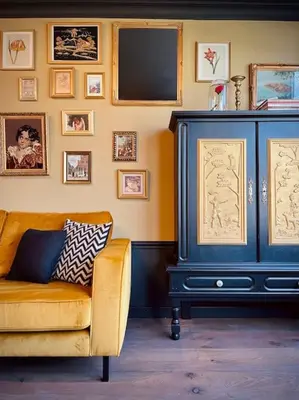 a living room with a blue cabinet and a yellow couch at City Apartment With Canalview at Canalhouse-Majestic in Utrecht