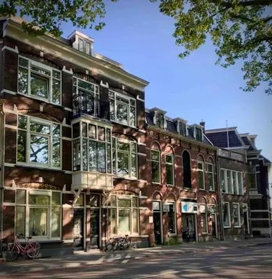 a large brick building with a lot of windows at City Apartment With Canalview at Canalhouse-Majestic in Utrecht