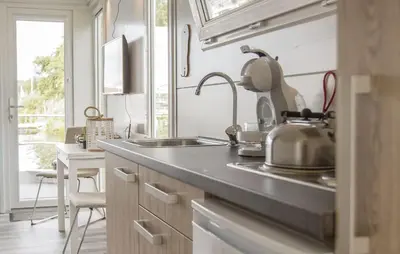 a kitchen with a sink and a counter top at Jack Sparrow in Almere